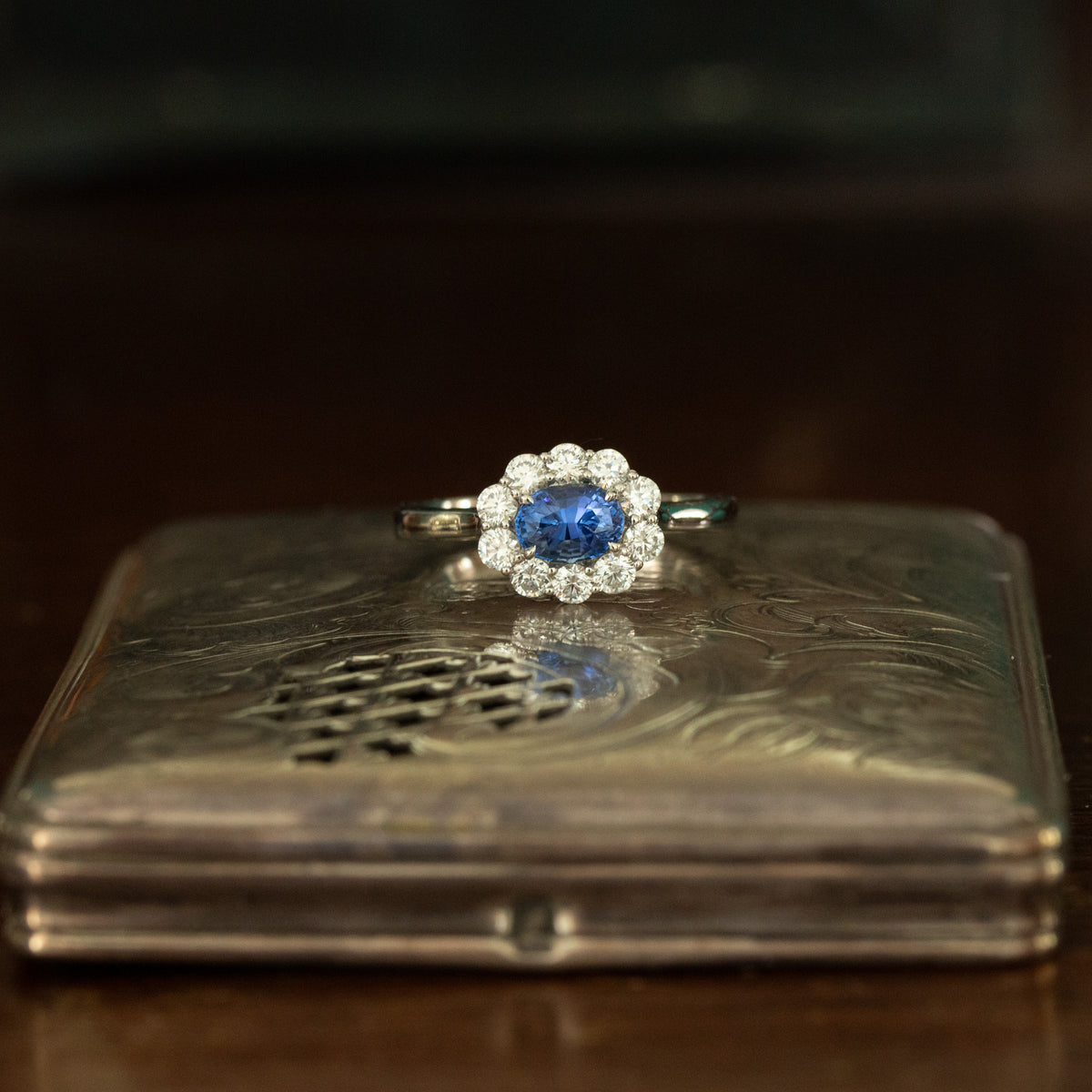 Oval Horizontal Blue Sapphire and Diamond Cluster Ring