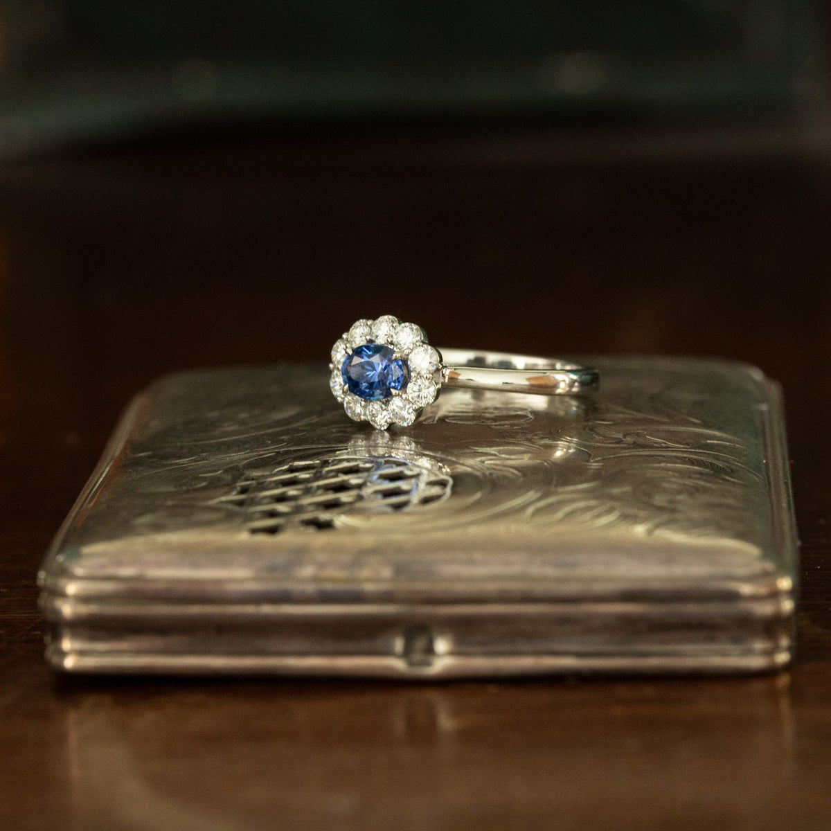Oval Horizontal Blue Sapphire and Diamond Cluster Ring