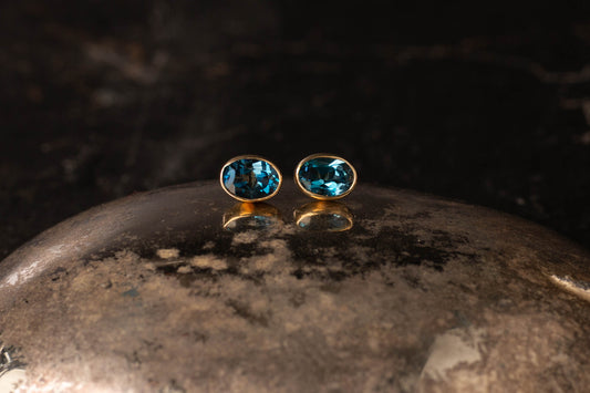 9ct Yellow Gold Oval Blue Topaz Stud Earrings