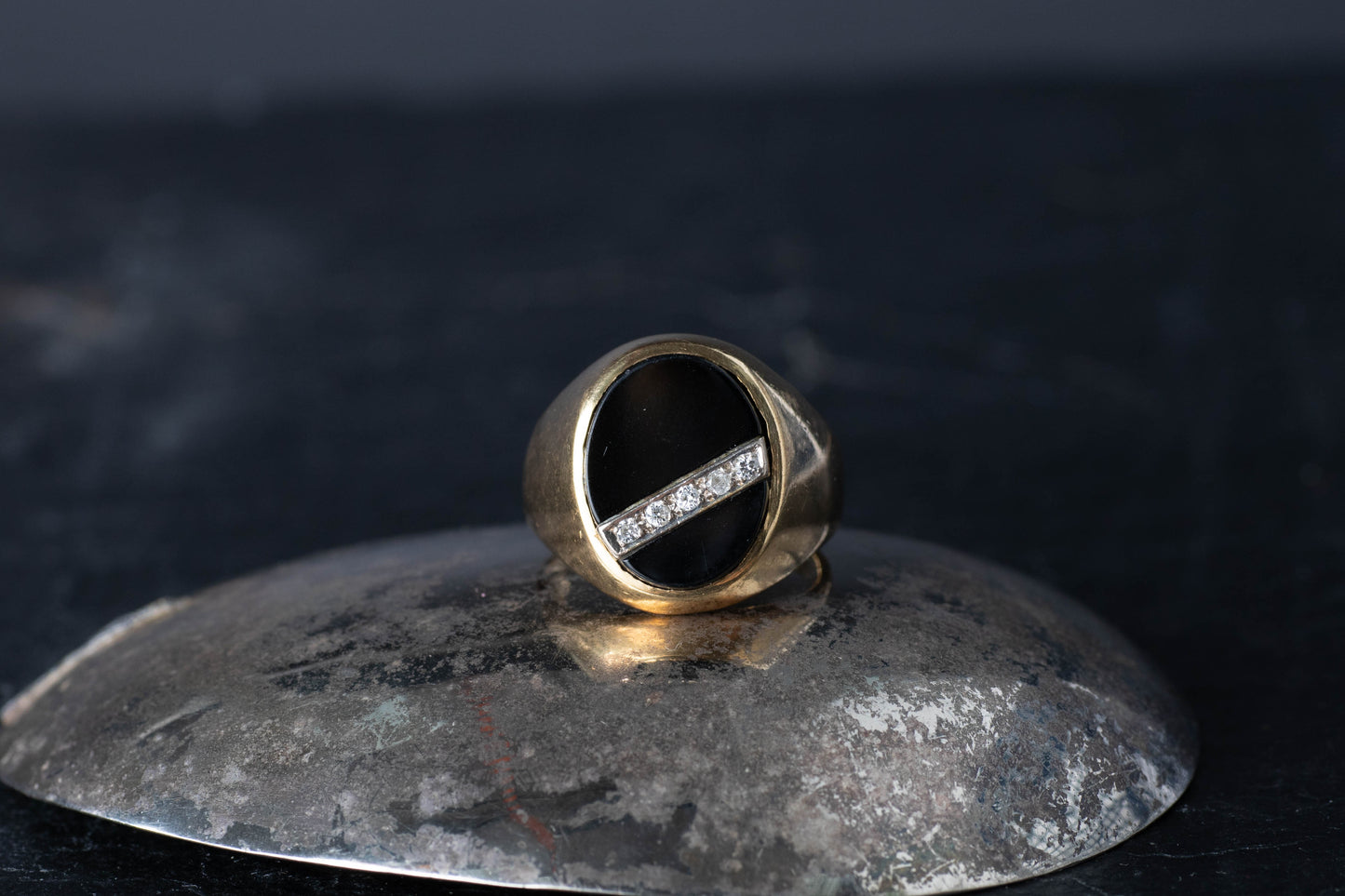 Vintage 1970 gents 18ct gold signet ring featuring oval onyx face with diagonal diamond row.