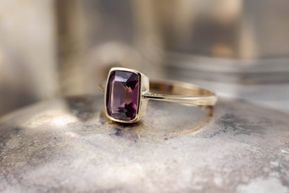 A Garnet Solitaire Ring — view 3